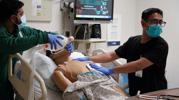 Doctors working in cadaver lab