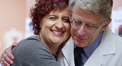 A patient hugging an AHN doctor.