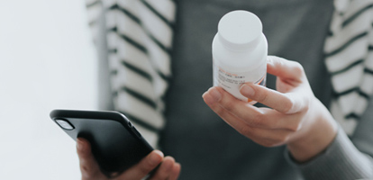 Woman using her cellphone to order a prescription refill on MyChart