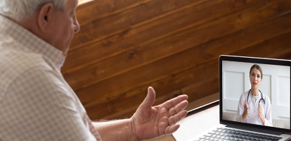 patient consulting with his doctor via telehealth video visit