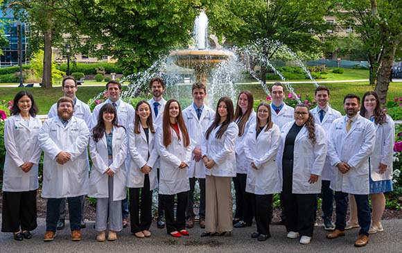 image of AHN Pharmacy Residents in front of the Northeast Fountain in Allegheny Commons Park
