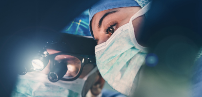 A close-up shot of a pair of surgeons performing a procedure.