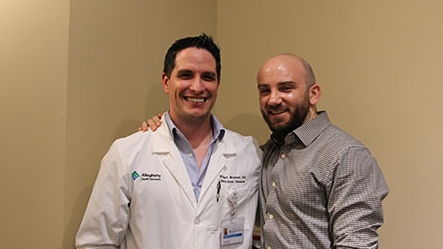 2018-2019 graduates Robert Brunner, DO and Nicholas Cheronis, MD standing next to each other.