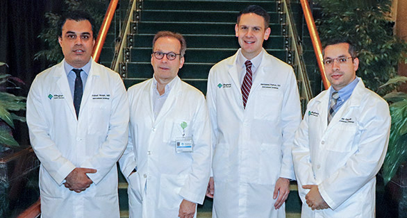 image of interventional cardiology graduates class of 2019 smiling in front of stairway