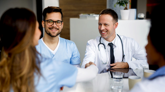 A doctor shaking hands with a prospective AHN resident.