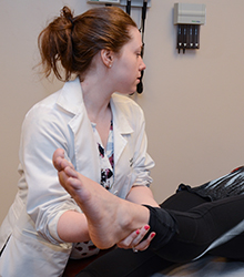 Doctor treating patients ankle/foot