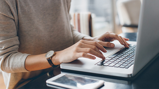 person on a computer laptop working