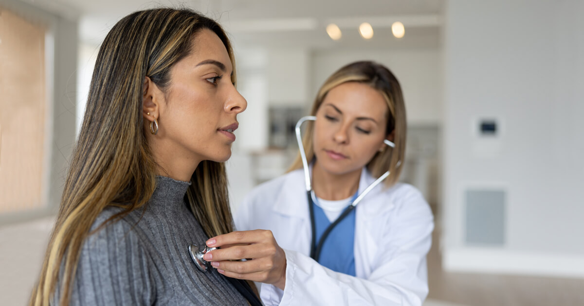 Woman being examined with stethoscope