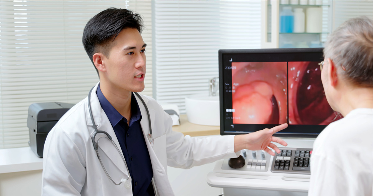 Doctor and patient reviewing colonoscopy image