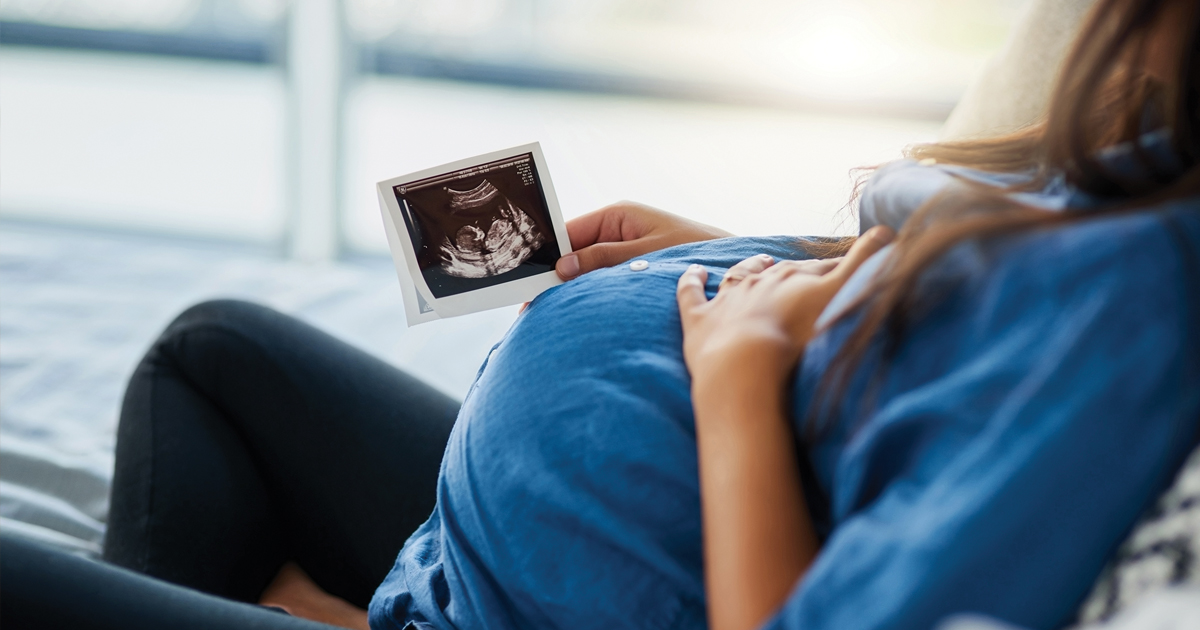 Pregnant mom looking at ultrasound image