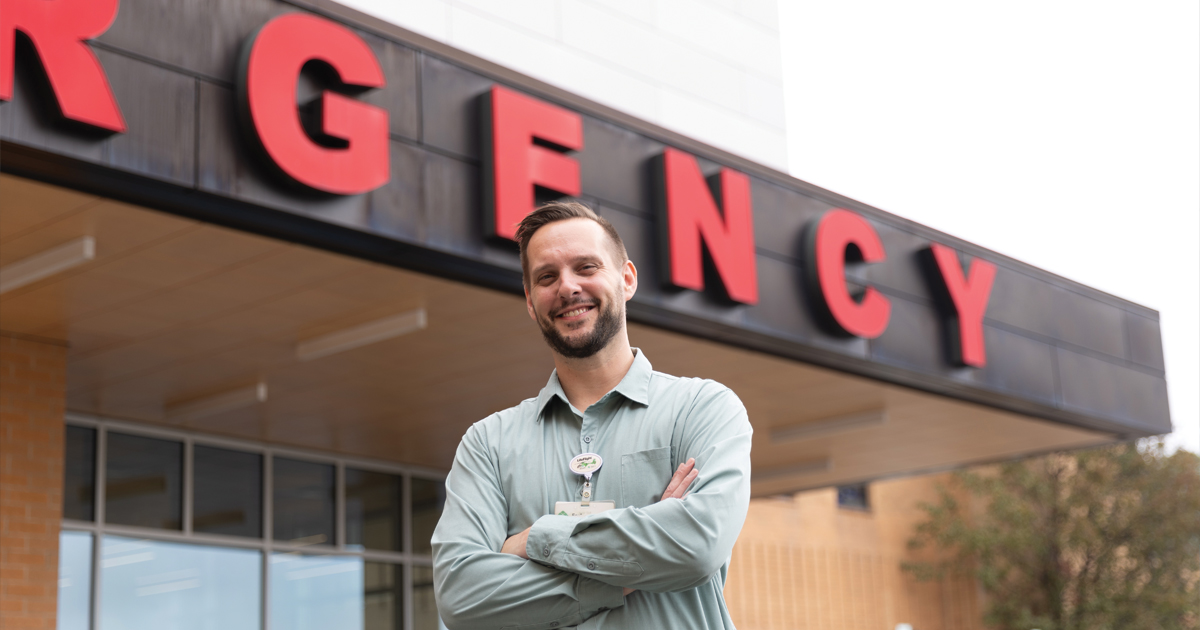 Mike Taramelli standing in front of Forbes Hospital ER