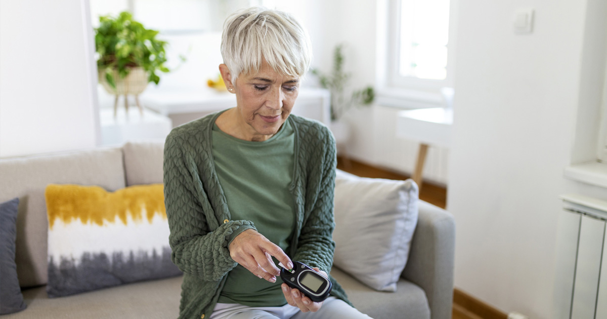 woman testing her blood sugar