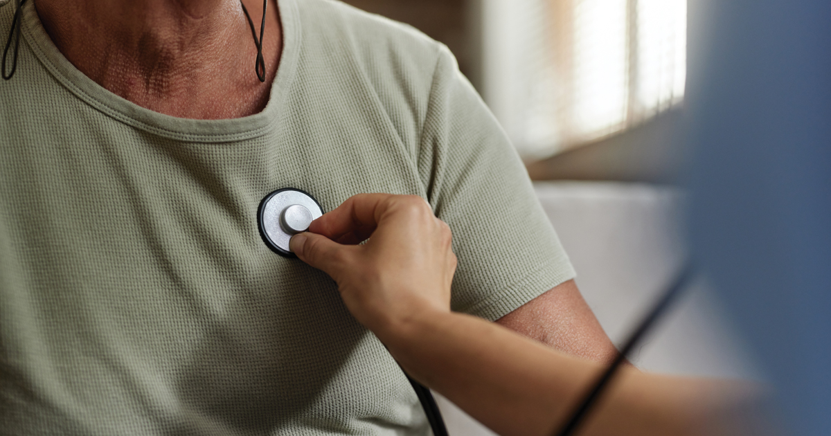 Stethoscope being used on man’s chest