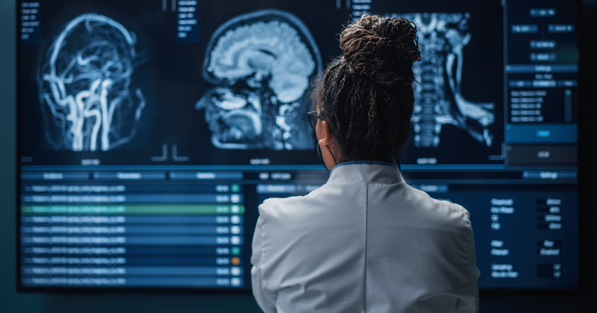 Doctor examining brain scan images on a screen