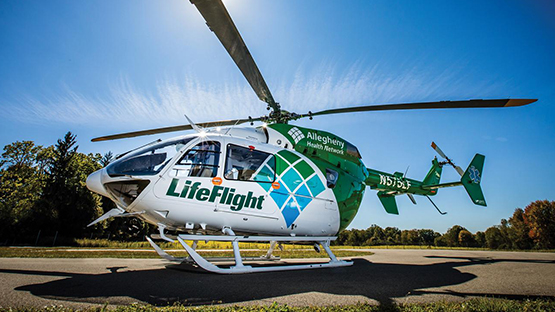 An AHN LifeFlight helicopter parked on a helicopter platform.