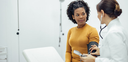 A physician taking a patient's blood pressure.