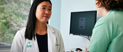 AHN OBGYN talking to a patient.