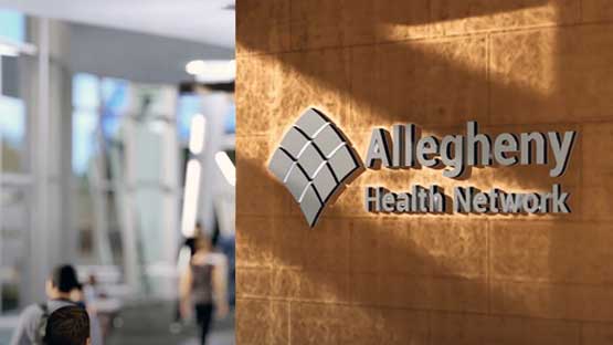 Allegheny Health Network sign on a wall in a new building