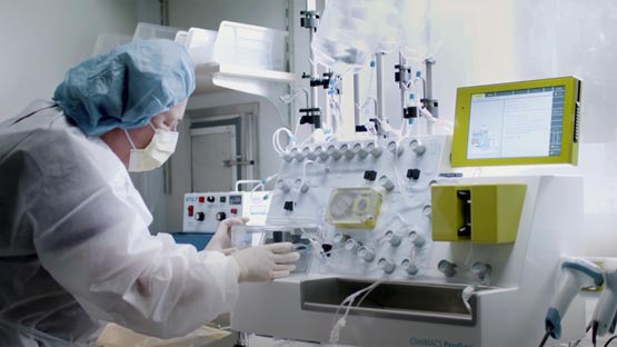 Medical researcher working on equipment in laboratory