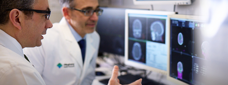 Two doctors reviewing a scan at the AHN Melanoma and Skin Cancer Center of Excellence.