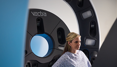 Patient undergoing whole-body 3D skin imaging with the VECTRA WB360 system at AHN.