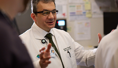 Doctor speaking to his colleagues.