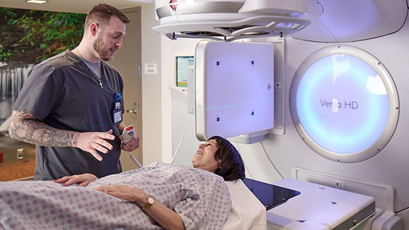 AHN Medical professional talking to patient about her radiation therapy treatment..