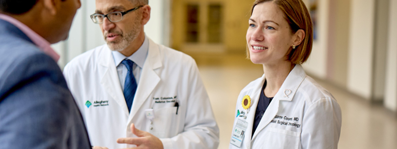 AHN doctors discussing a patient's treatment for breast cancer.