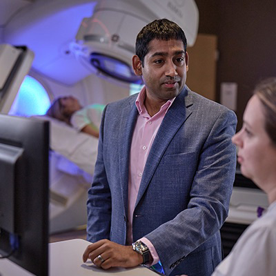 AHN cancer specialist reviewing a scan with a patient.