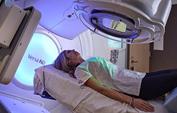 Patient lying down and getting a scan.