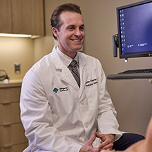 AHN cancer specialist talking to patient.