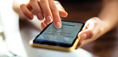 A woman's hands holding a smart phone 