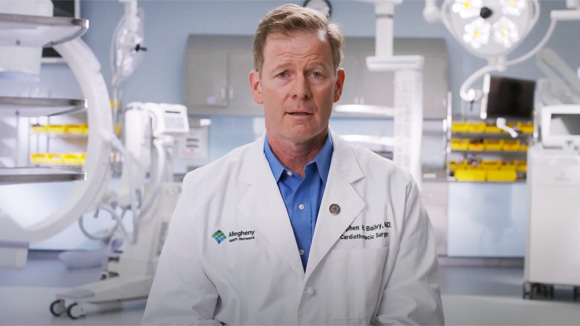 Dr. Stephen Bailey talking in a surgery room