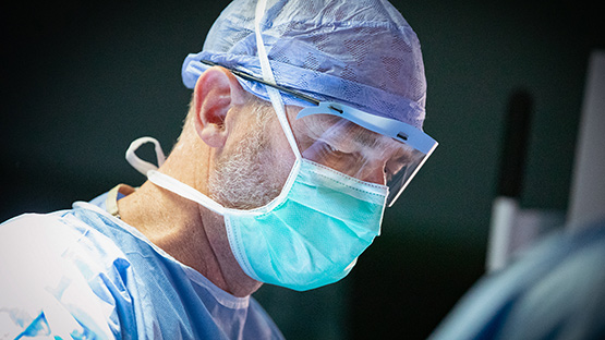 Dr Jobe focusing on surgical procedure