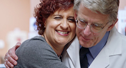 image of a patient hugging a doctor