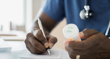 image of a doctor writing a prescription