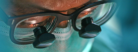 image of a surgeon examining a patient