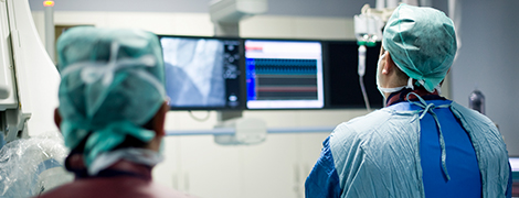 image of a pair of surgeons looking at a screen