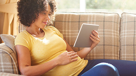 A rwomann scheduling an appointment on a tablet device.