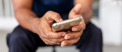 Close up view of hands holding a smartphone