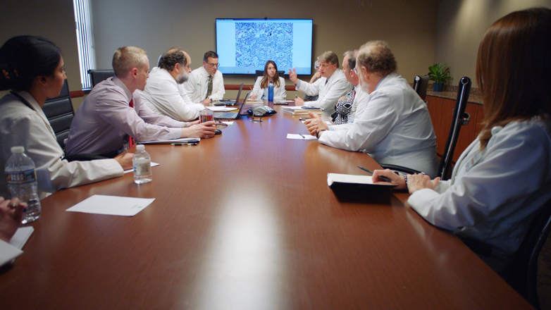 image of genomic tumor board discussing treatment options