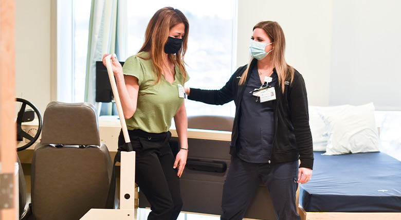 physical therapist helping a patient