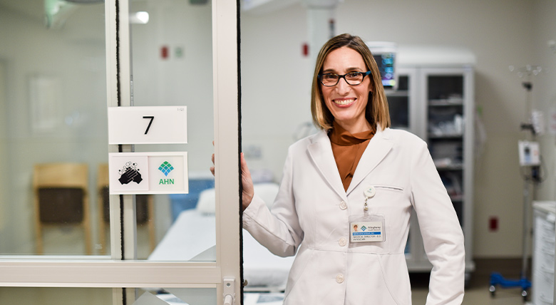 doctor posing for a picture in the hospital