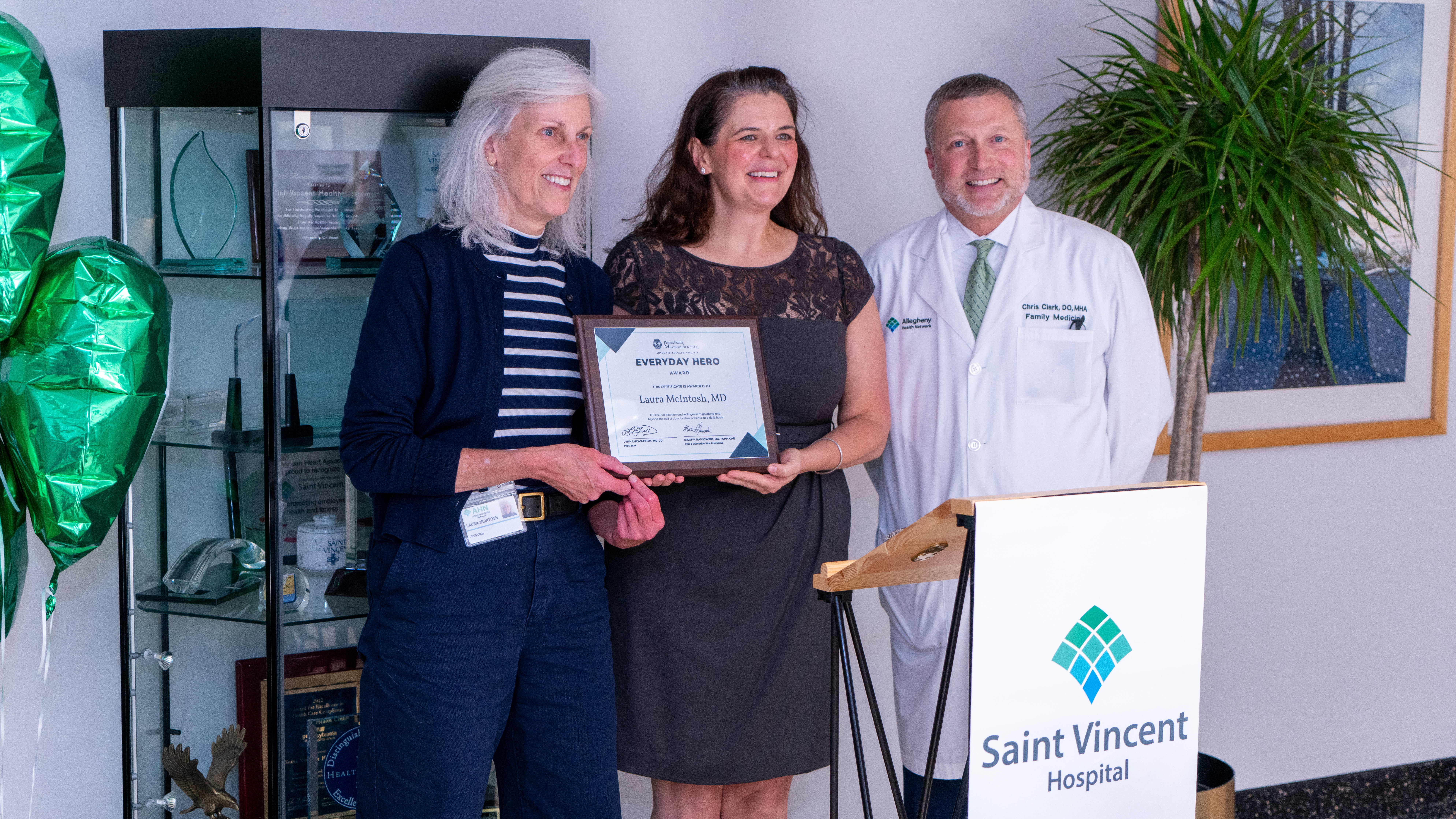 Photo of Dr. McIntosh with Dr. Amanda Wincik of the Erie Medical Society and Dr. Chris Clark, AHN Saint Vincent President