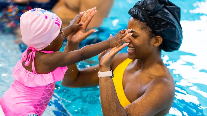 Mother and daughter in swimming pool