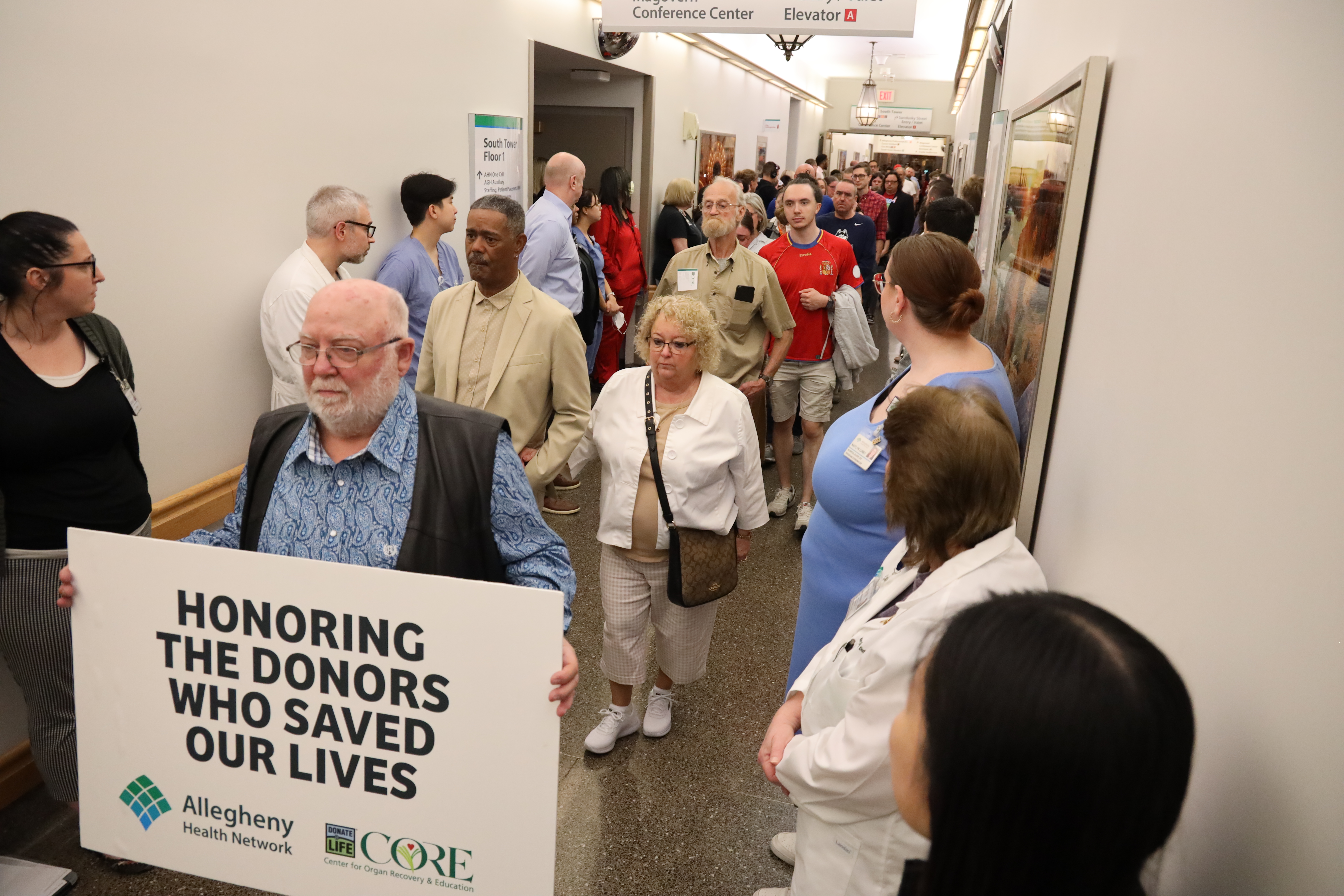 Donor families honor walk in hospital hallway