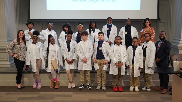 Middle School STEMM students at the STAR Center participate in a "white coat" graduation ceremony.